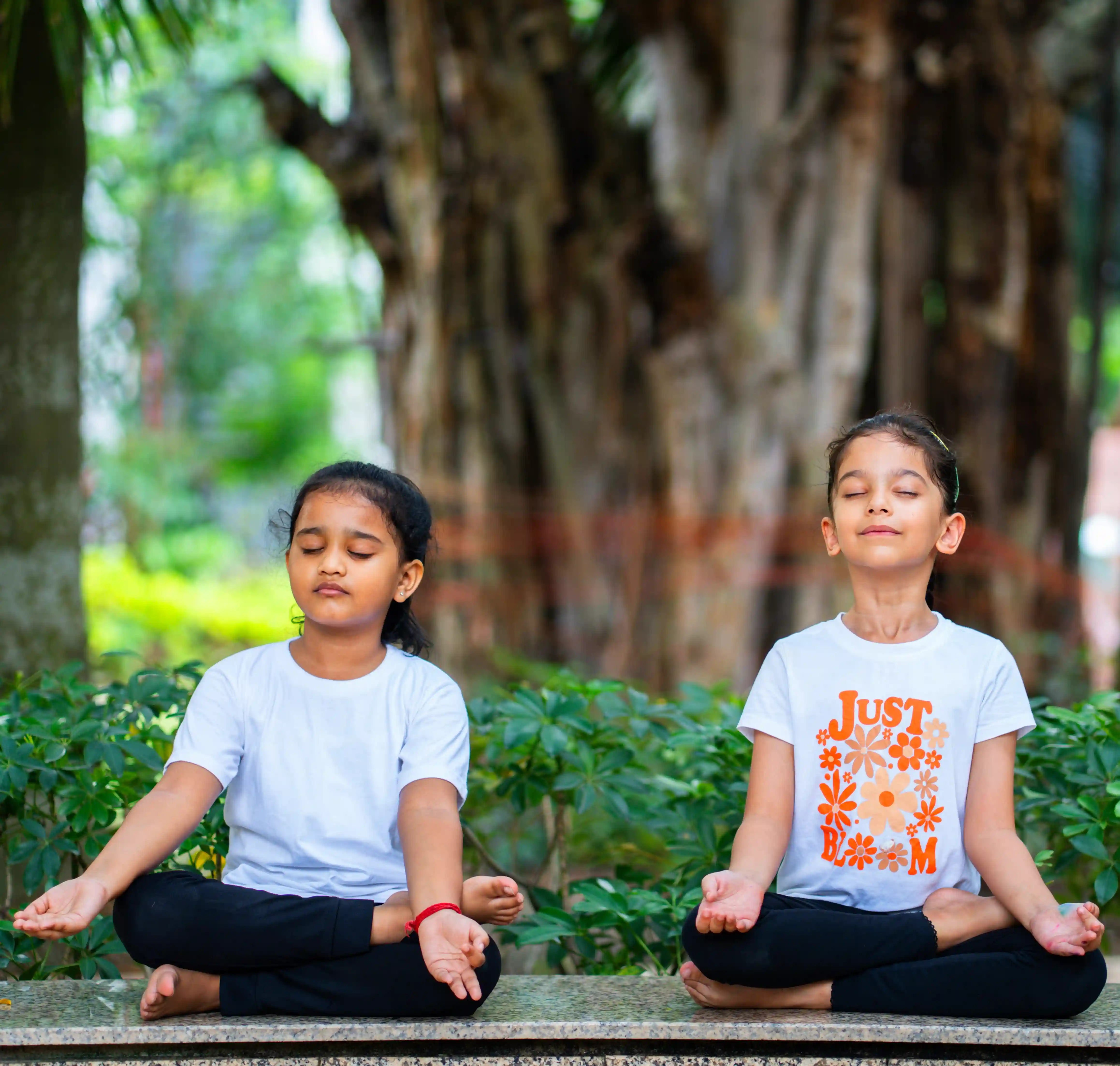 A healthy child experiencing the immense physical benefits of yoga exercises at home during a fun yoga beginners course, safely guided by Gaurav Tribedi at Nabatara.