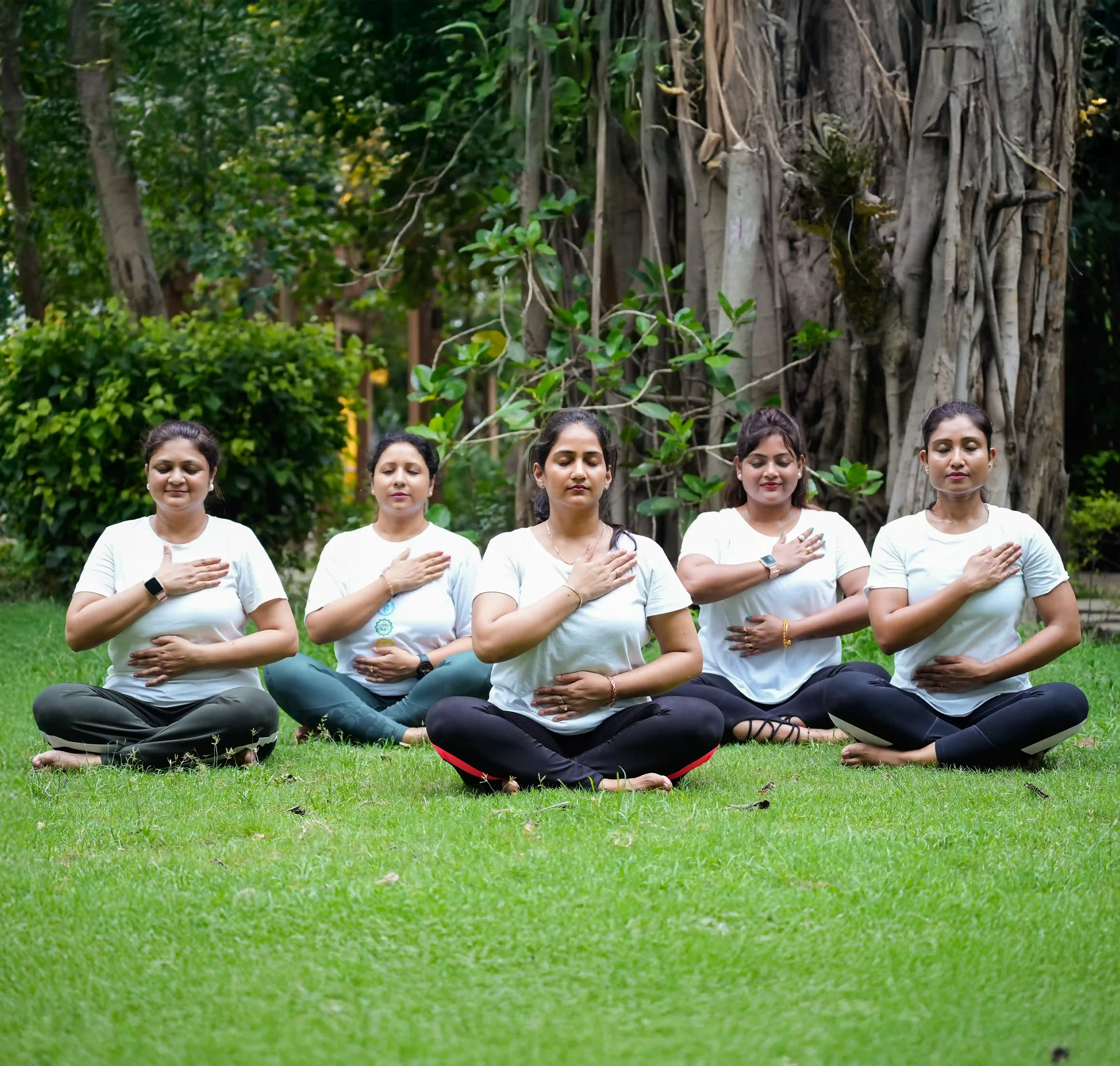 An advanced practitioner at Nabatara, guided by Gaurav Tribedi, achieving a deep spiritual awakening by perfectly aligning the kundalini chakras in human body during a sunset meditation.