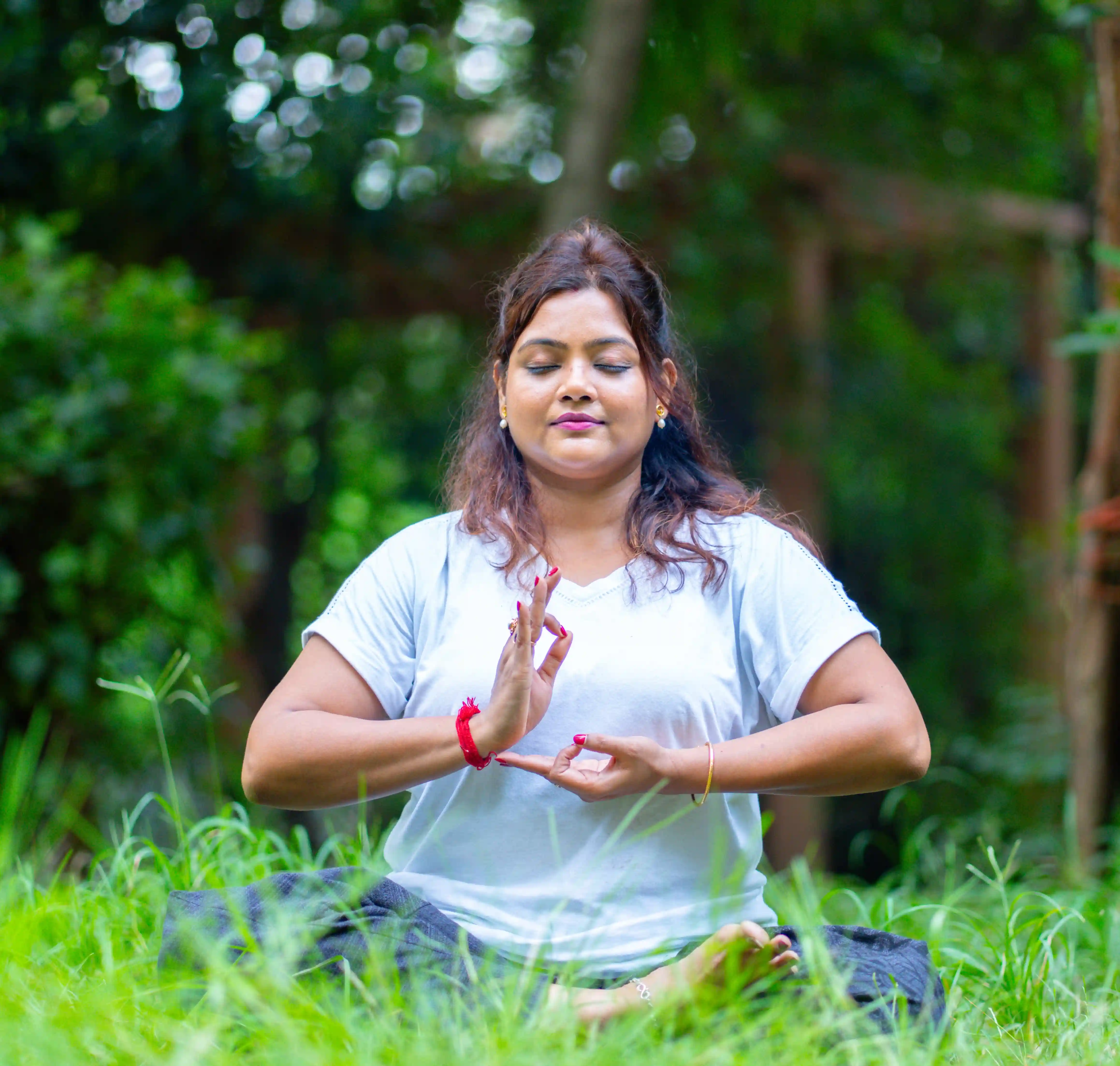 A student exploring the spiritual benefits of a yoga beginners course and kundalini chakra awareness, guided by Gaurav Tribedi at Nabatara Institute.